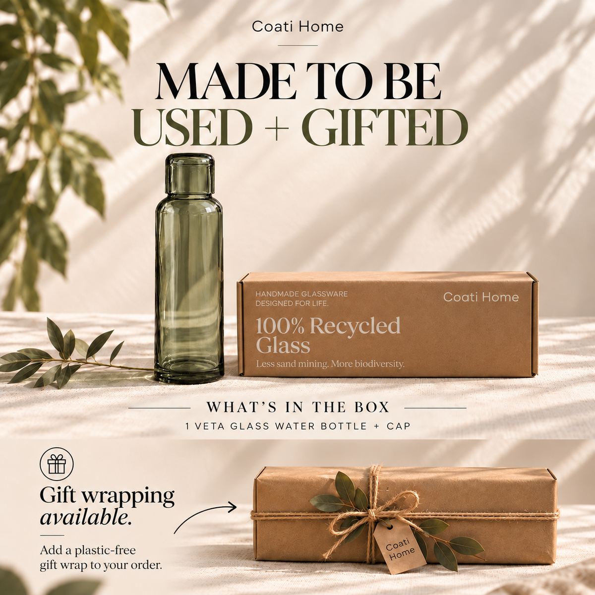 Coati Home 100% recycled glass water bottle and its kraft paper gift box, presented on a sunlit beige fabric surface with decorative leaves. Text highlights 'Made to be used + gifted' and 'What's in the box: 1 Veta glass water bottle + cap'.